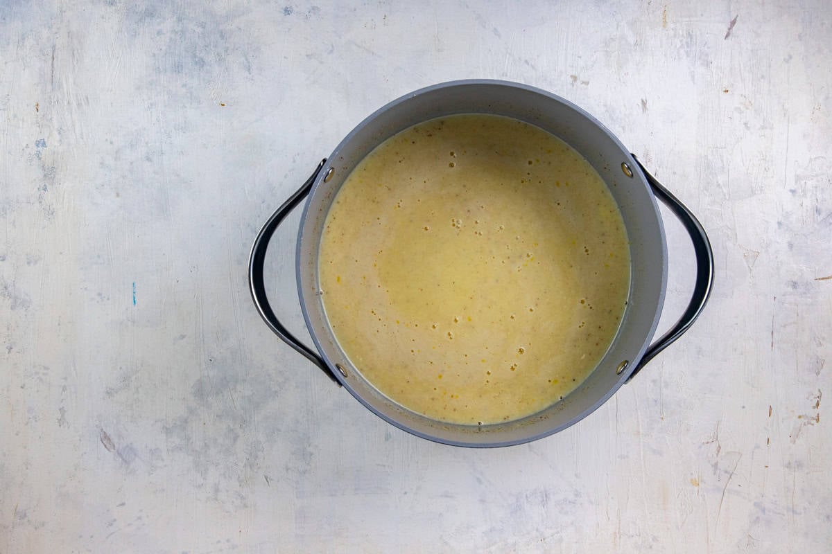 Egg and sugar mixture in a saucepan.