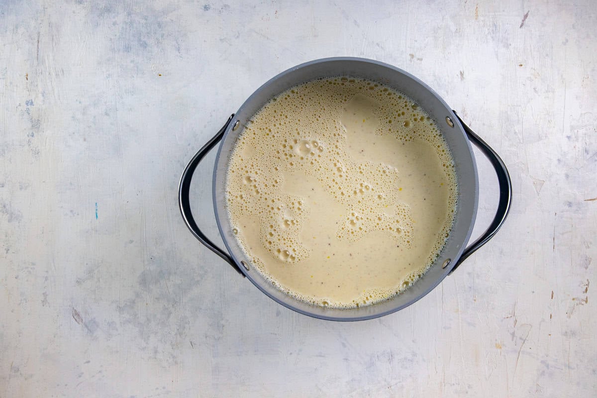 Evaporated milk mixture blended with the egg and sugar mixture in a sauce pan.