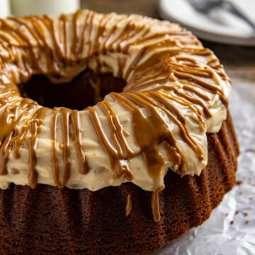 Baked cake with frosting and drizzle.