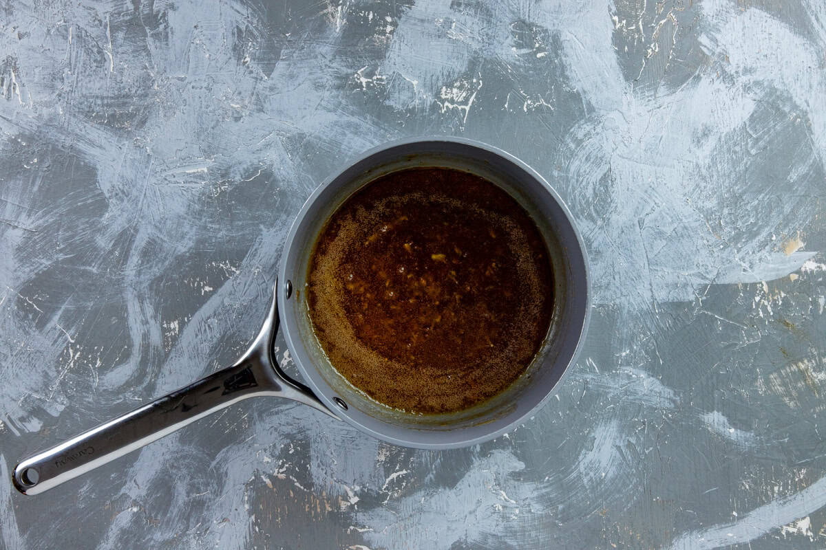 Orange marmalade glaze in a small sauce pan.