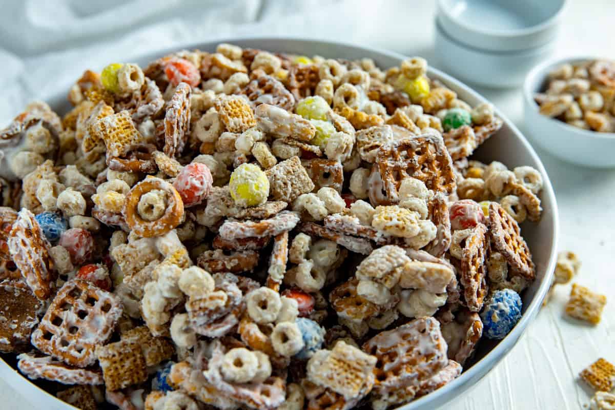 White chocolate snack mix in a large white bowl.