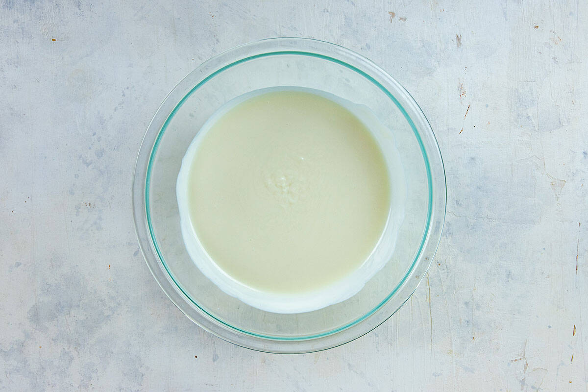 Melted almond bark in a glass bowl.