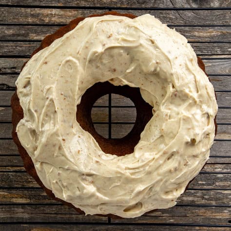 Baked Bundt cake with cream cheese frosting.