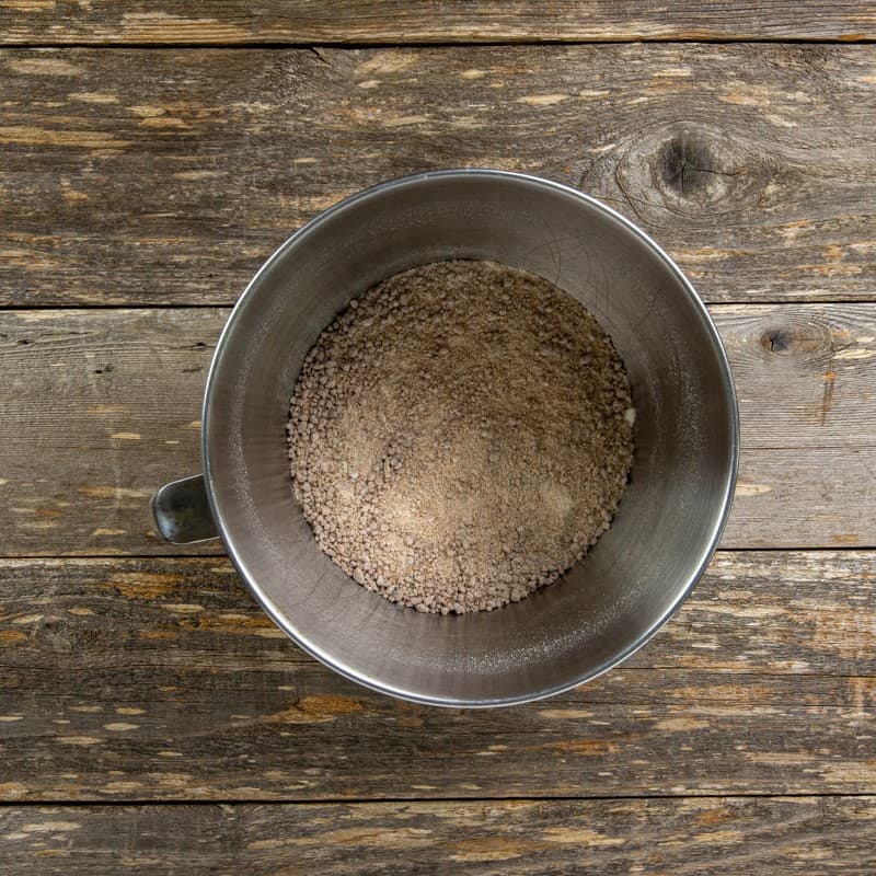 Flour, sugar, baking powder, salt, and ground cookies in a mixing bowl.