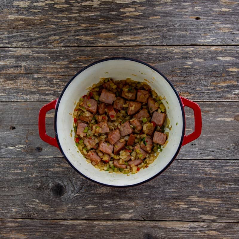 Browned, chopped onion, bell pepper, and celery added to the dutch oven.