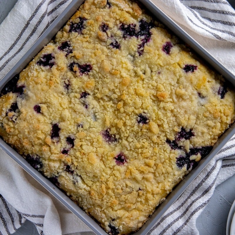 Baked coffee cake in a square baking pan.