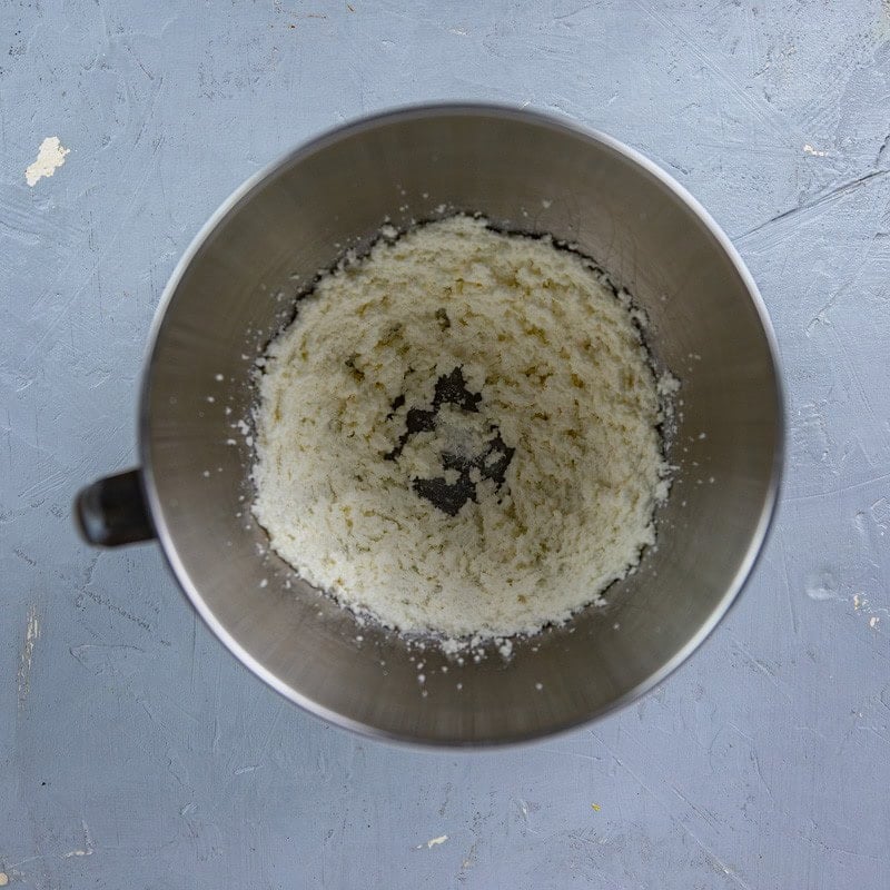 Sugar and butter creamed together in a bowl.