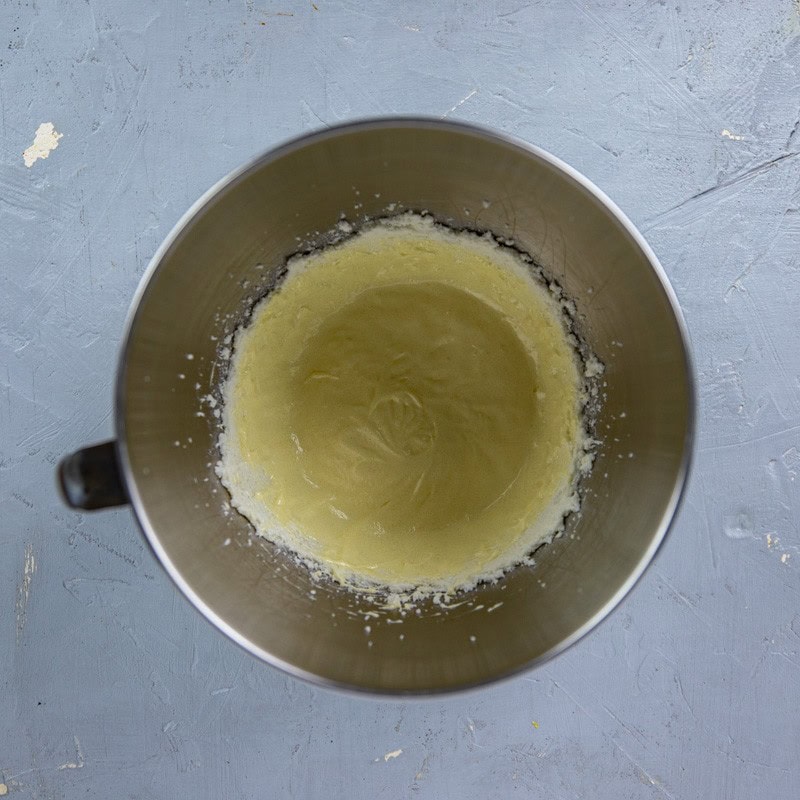 Egg, milk, and lemon juice added to the sugar-butter mixture.