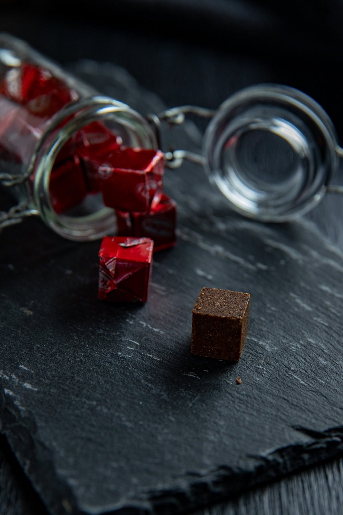 Individually wrapped beef bouillon cubes in a small glass jar.