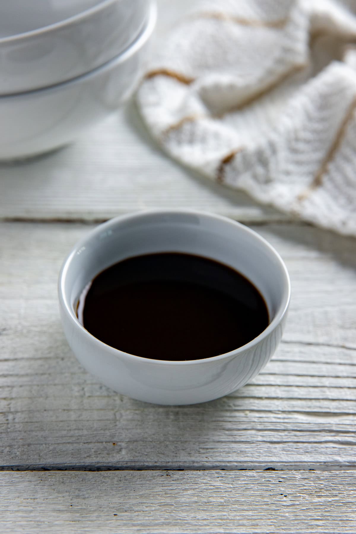 Worcestershire sauce in a small, round white bowl.
