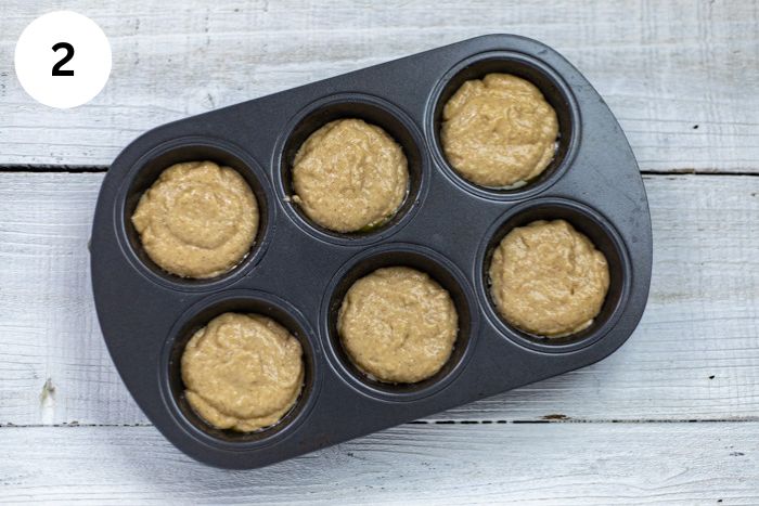 Muffin batter in the muffin pan,