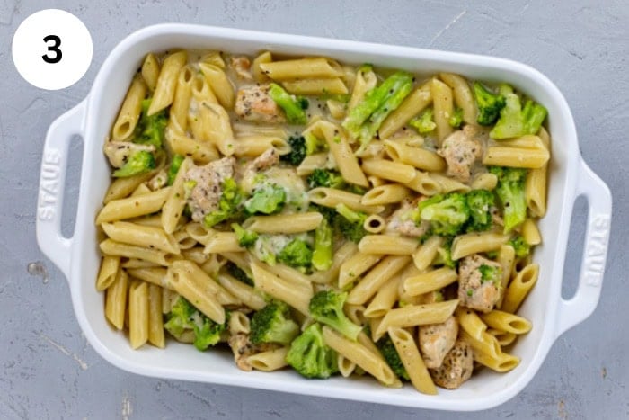 All ingredients added to a white casserole dish before baking.