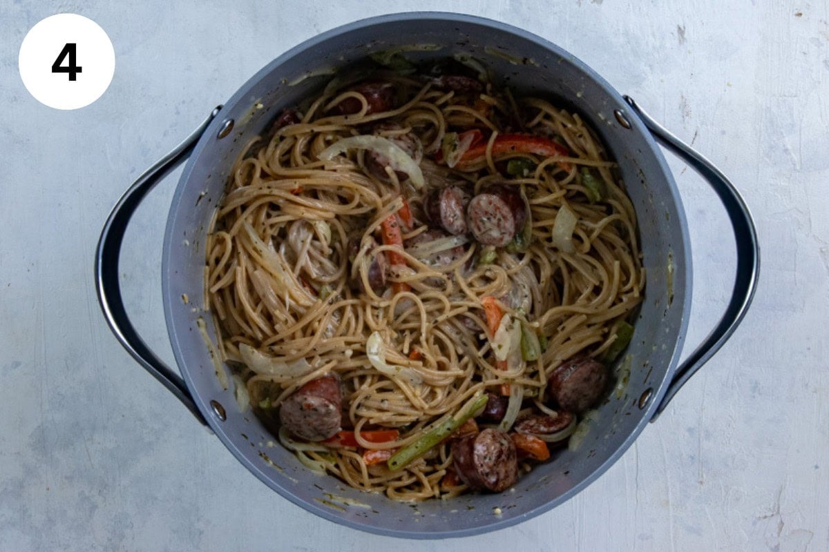 Cooked Cajun spaghetti in the pot with cream cheese stirred in.