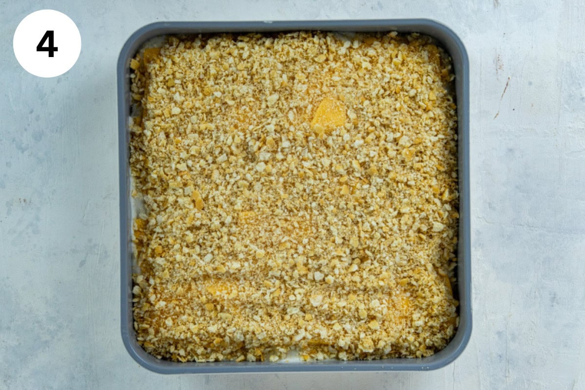 A layer of crushed Ritz crackers on top of the Velveeta cheese layer.