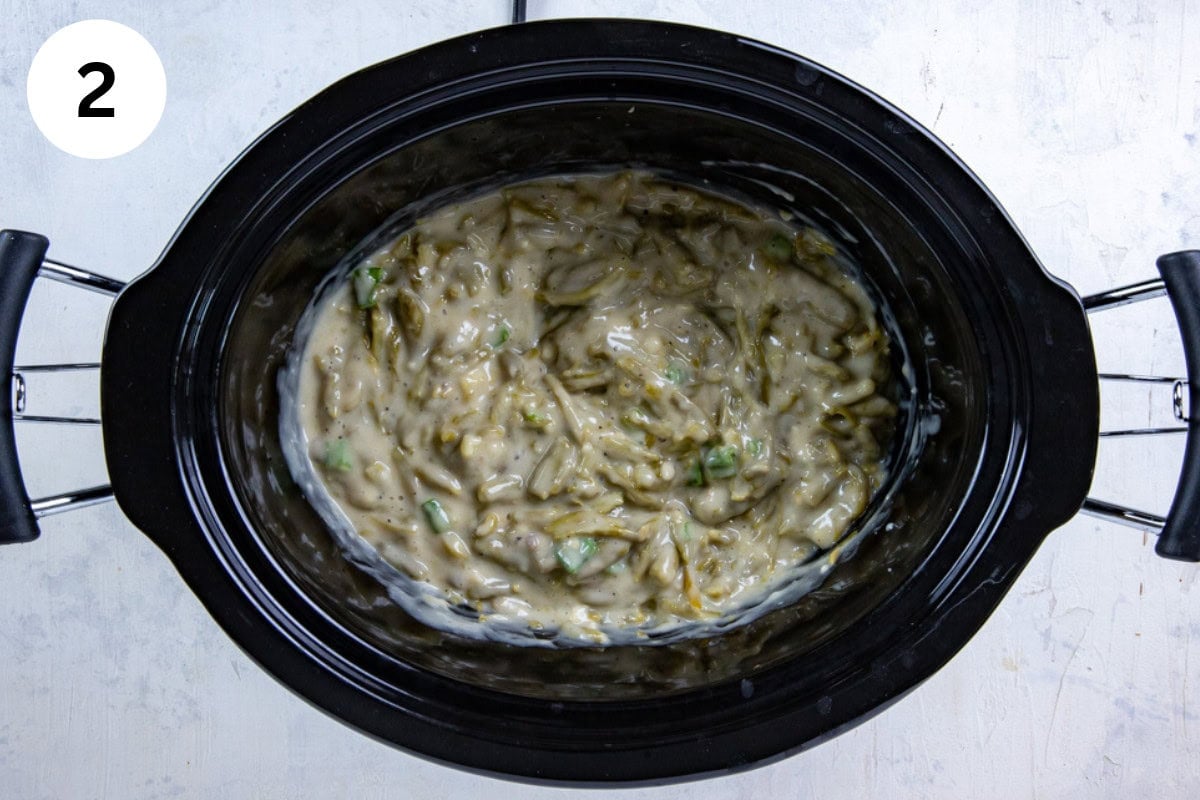 The soups, green onions, soy sauce, garlic, and pepper added to the green beans and blended together.