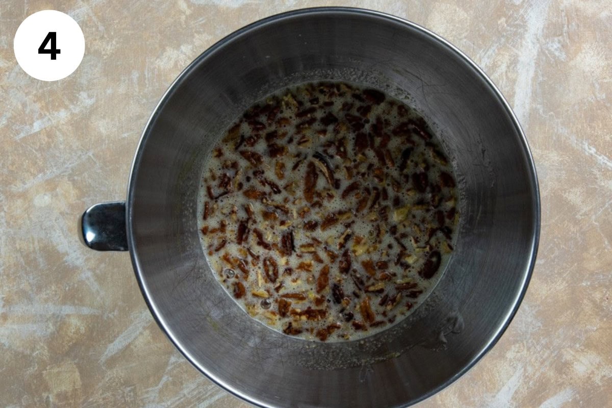 Chopped pecans added to the egg, vanilla extract, butter, sugar, corn syrup and salt mixture.