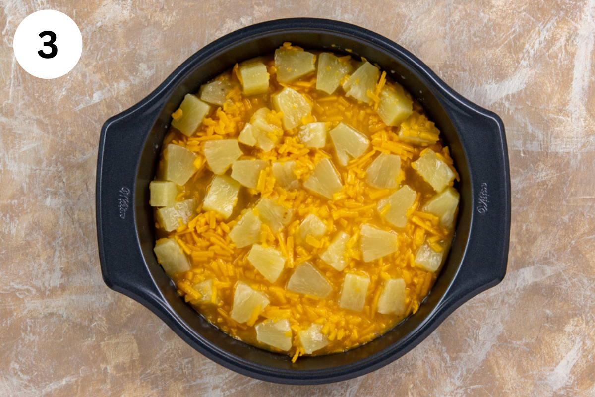 Pineapple mixture spread into a pie plate.
