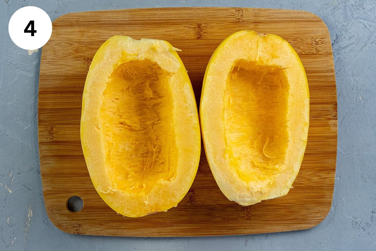 Spaghetti squash cut lenghwise with seeds removed.