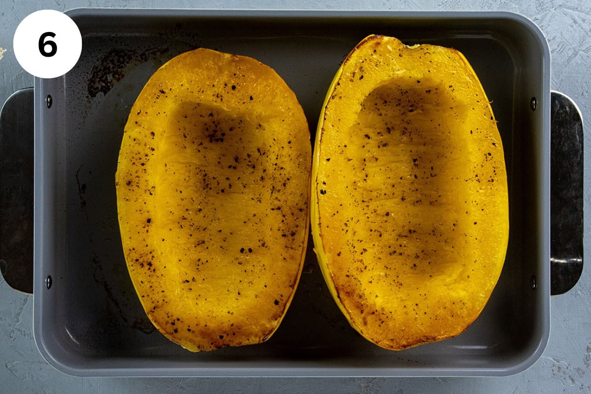Two baked spaghetti squash halves.