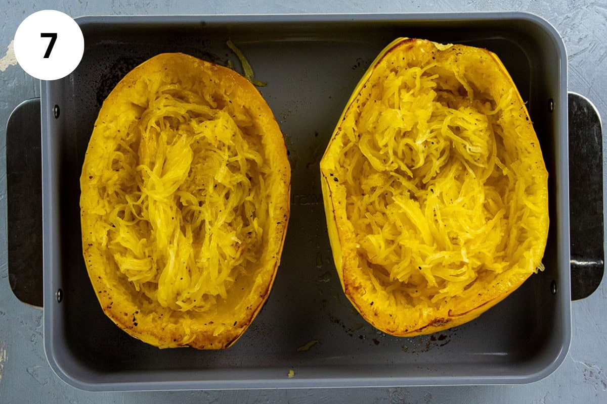 Tender strands of roasted spaghetti squash loosened with a fork