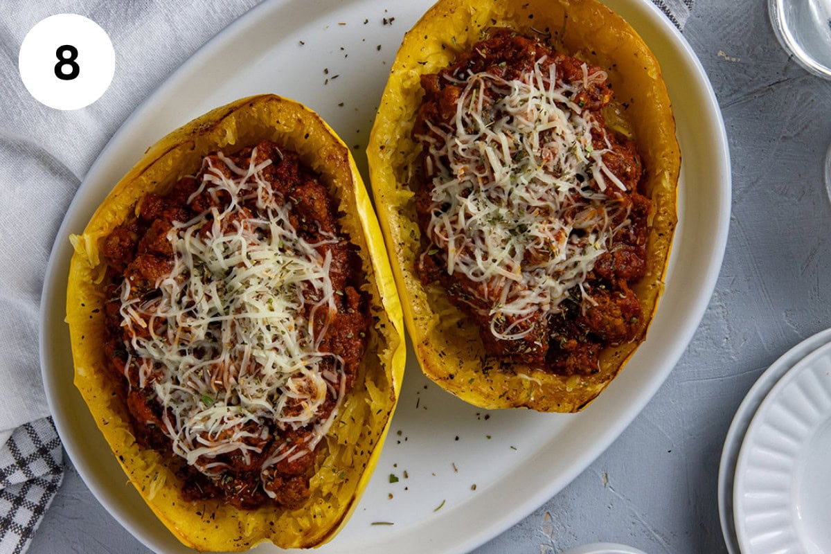 Roasted spaghetti squash boats filled with meat sauce and topped with melted mozzarella