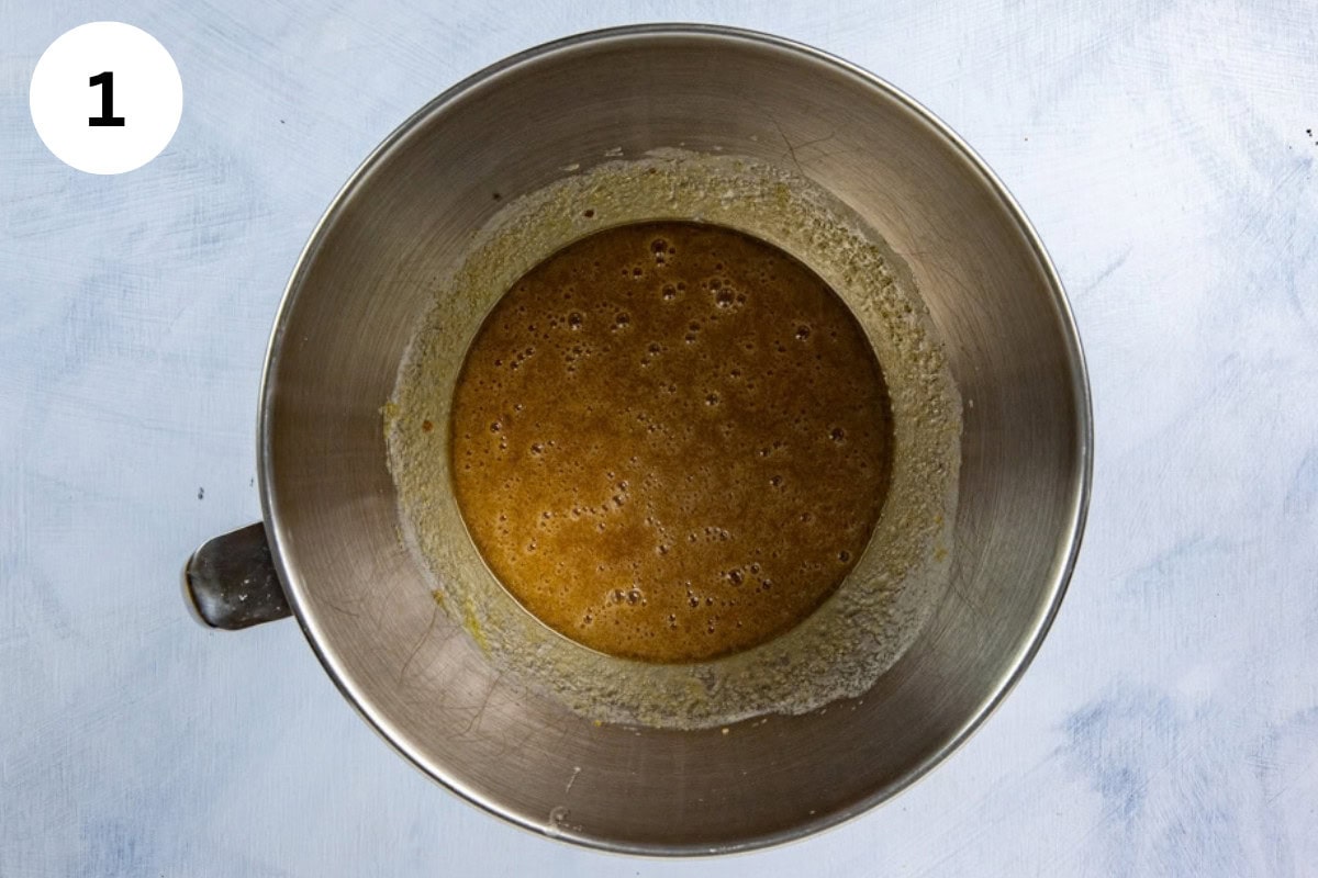 Butter and sugar blended in a mixing bowl.