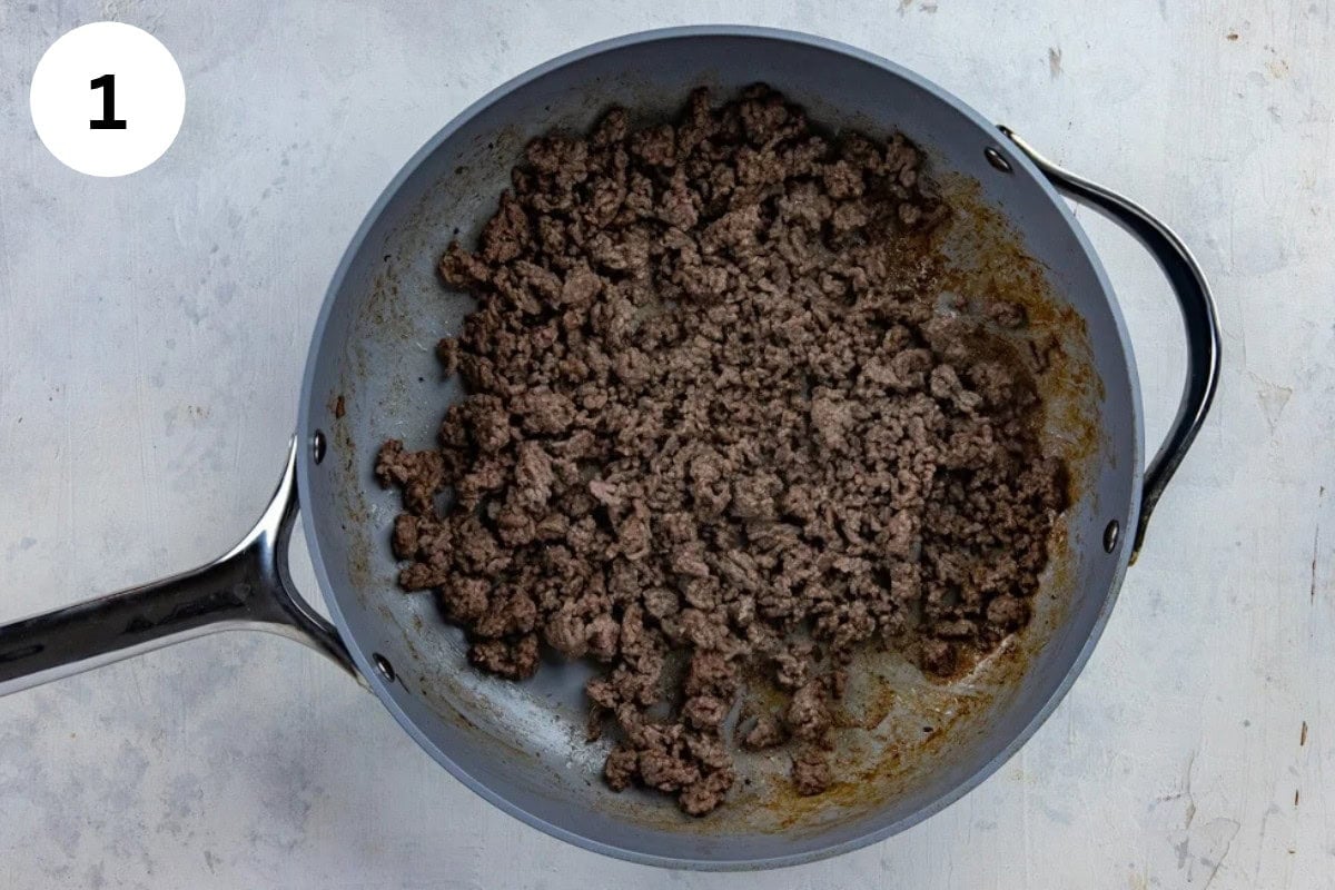 Cooked ground beef in a skillet.